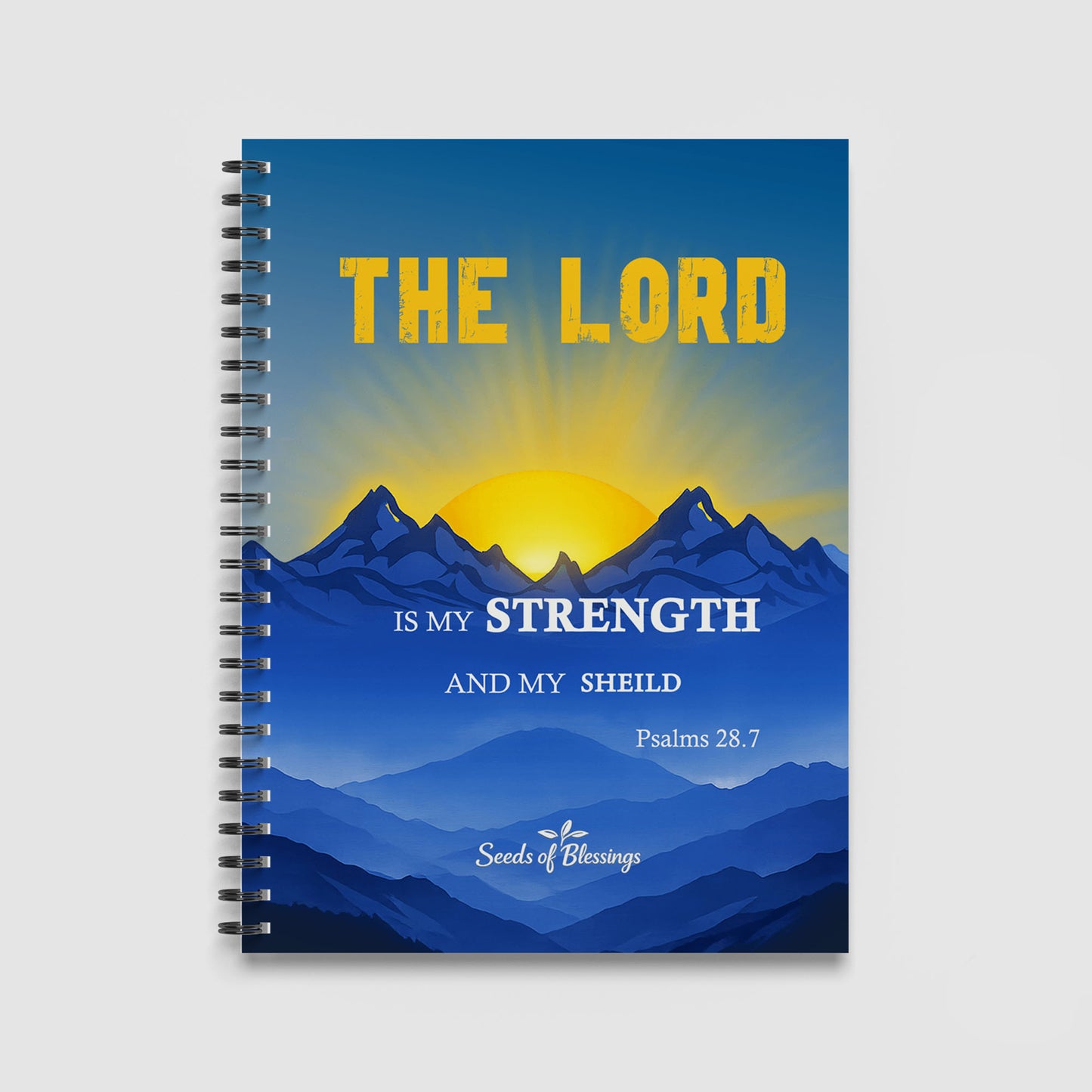 Spiral Notebook A4 - Golden text 'The Lord' displayed above layered blue mountains with bright yellow sunrise
