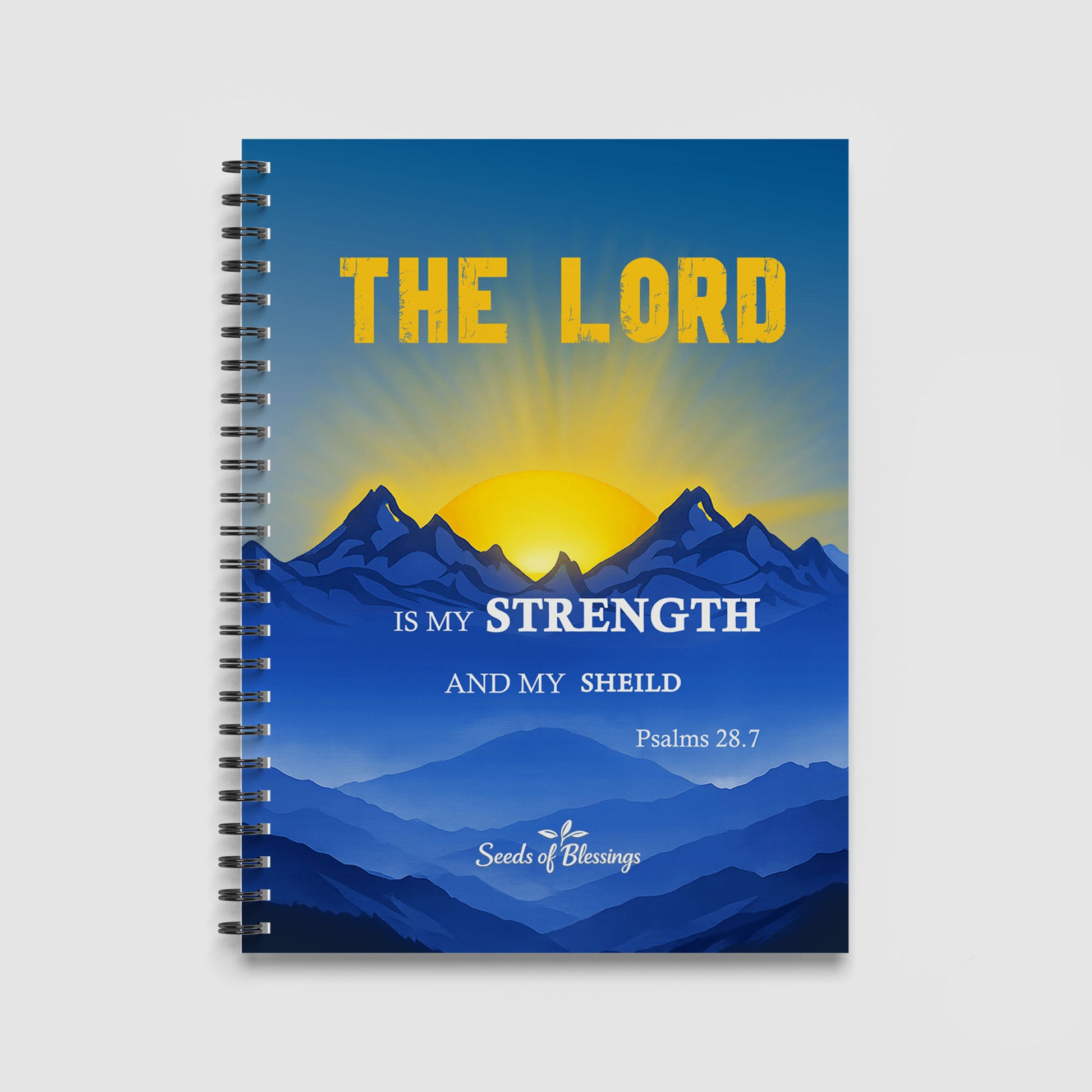 Spiral Notebook A4 - Golden text 'The Lord' displayed above layered blue mountains with bright yellow sunrise