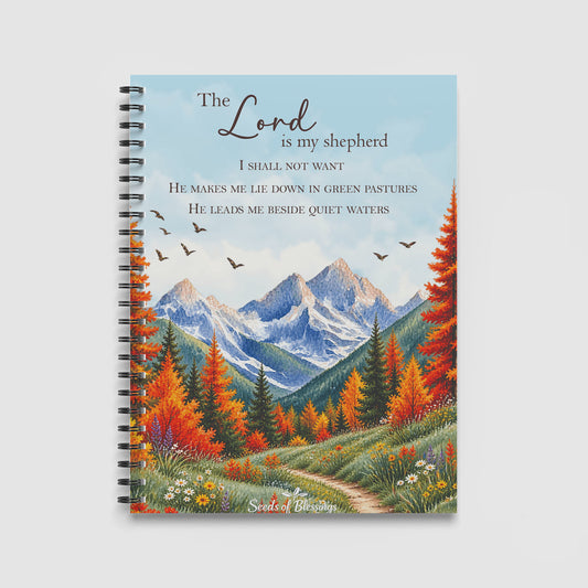 Spiral Notebook A4 - Psalm 23 scripture text overlaid on autumn mountain landscape with golden and orange trees, snow-capped peaks, and wildflower meadow